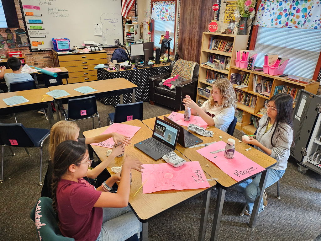 students working in groups in a classroom