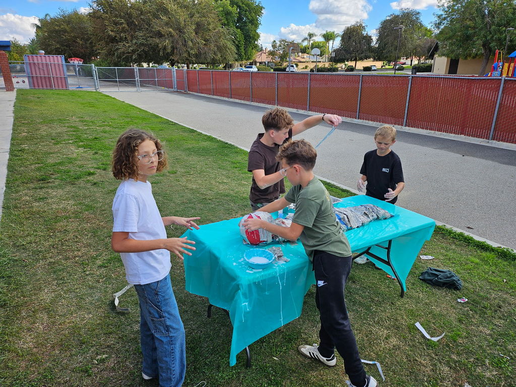 students working on tables outside