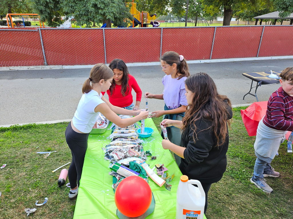 students working on tables outside