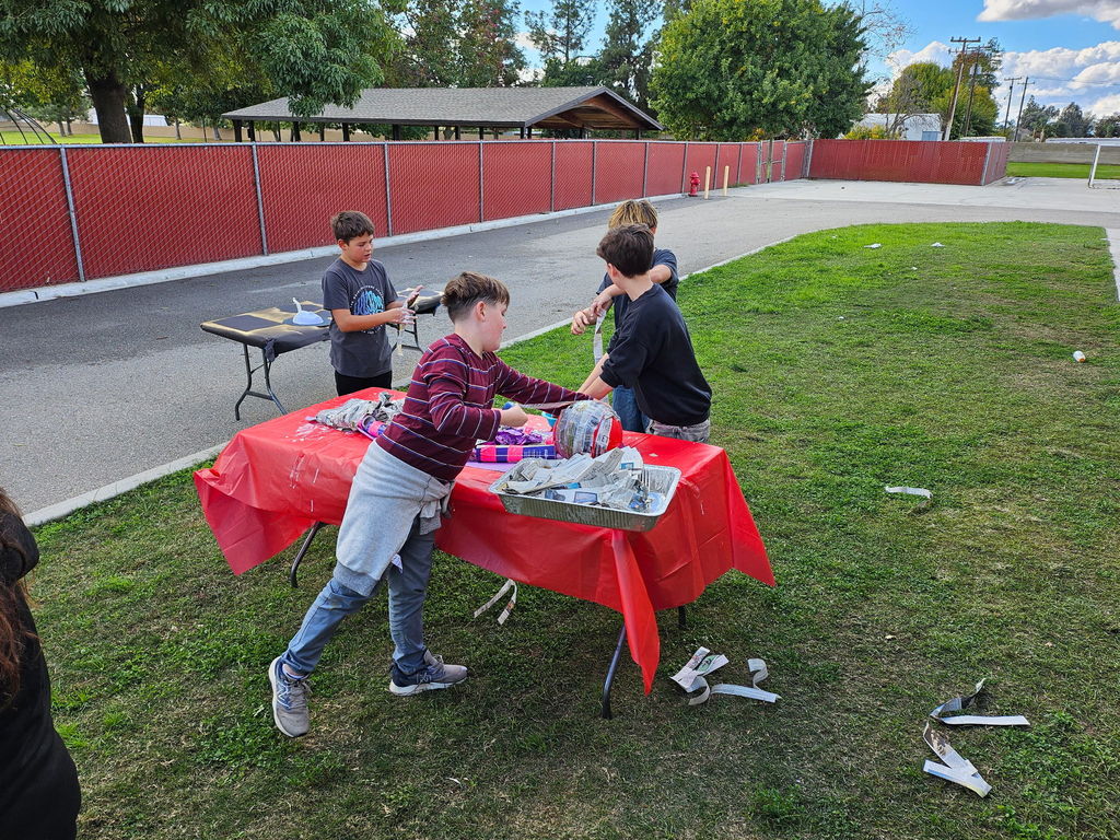 students working on tables outside