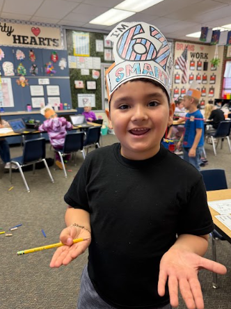 student wearing a 67 hat