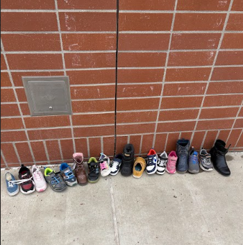 shoes lined up by a wall