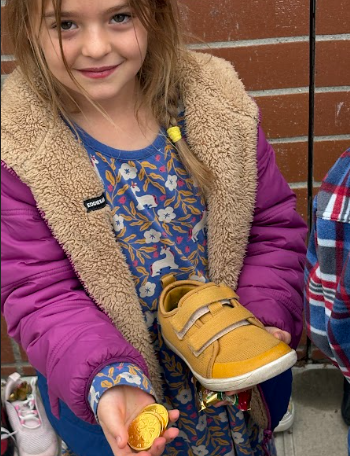 student  looking at their shoes with treats
