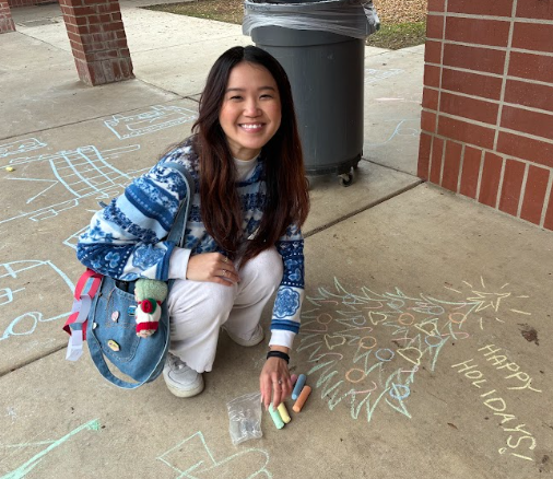 student with chalk
