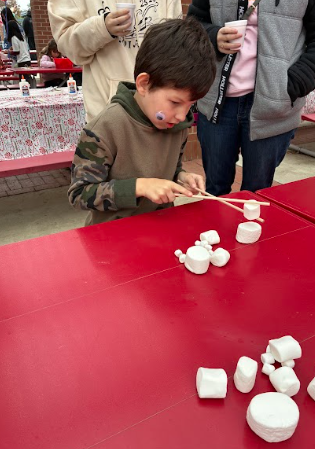 student with marshmallows