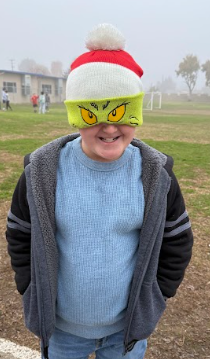 student dressed in red and green