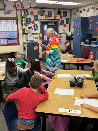 students listening to science teacher
