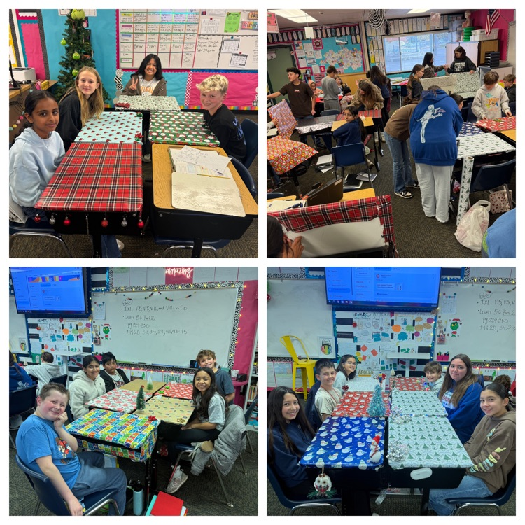 students sitting at desks wrapped in Christmas wrapping paper