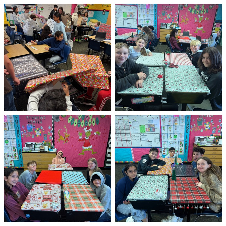 students with desks wrapped in wrapping paper