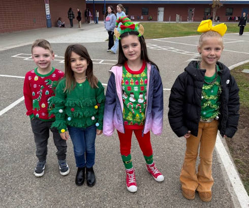 students in Christmas sweaters