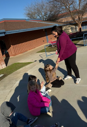students outside with teacher