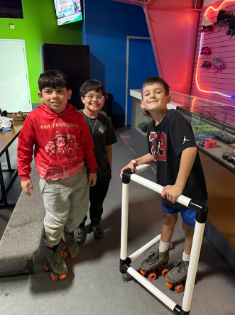boys at roller rink in skates