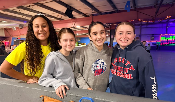 girls at roller rink in skates