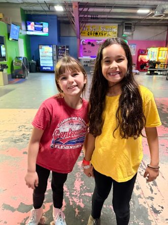 girls at roller rink in skates