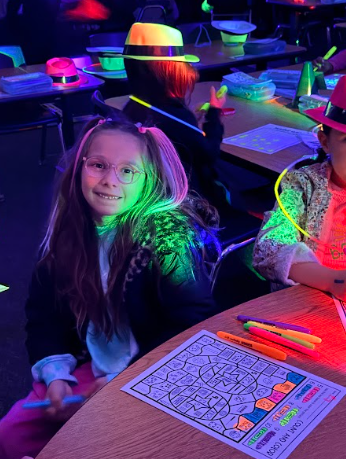 student working with Glow in the dark paper