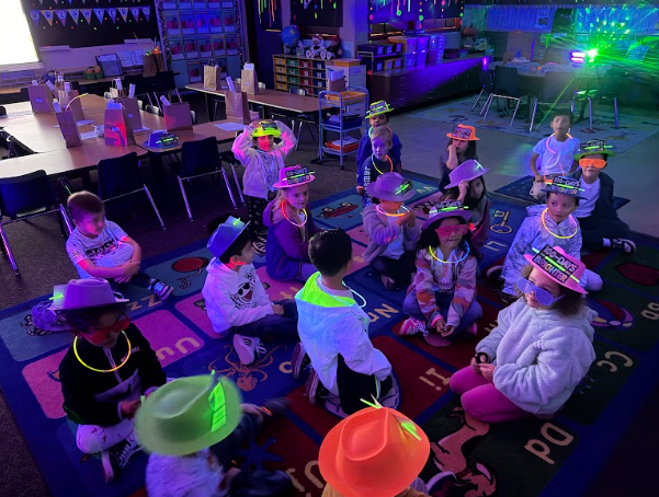 students wearing Glow in the dark hats and sunglasses