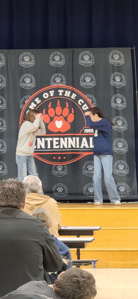 students performing on stage