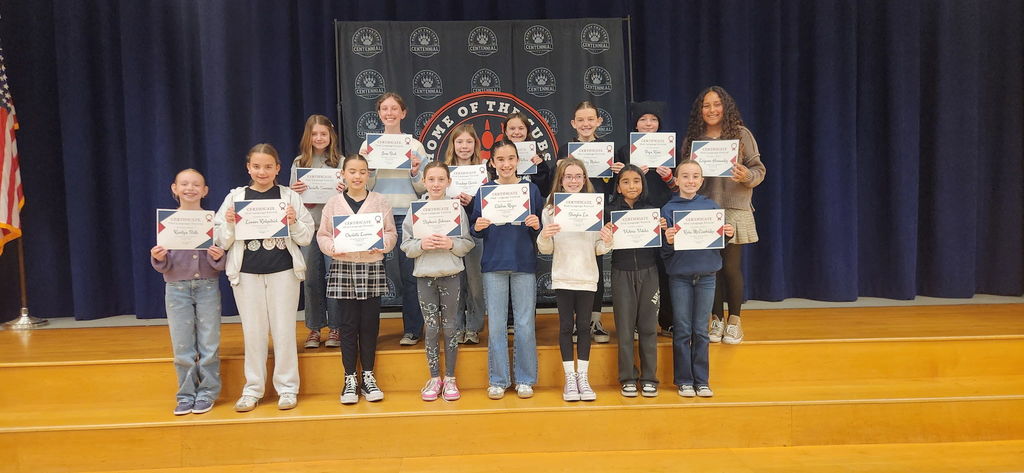 Students on stage with certificates