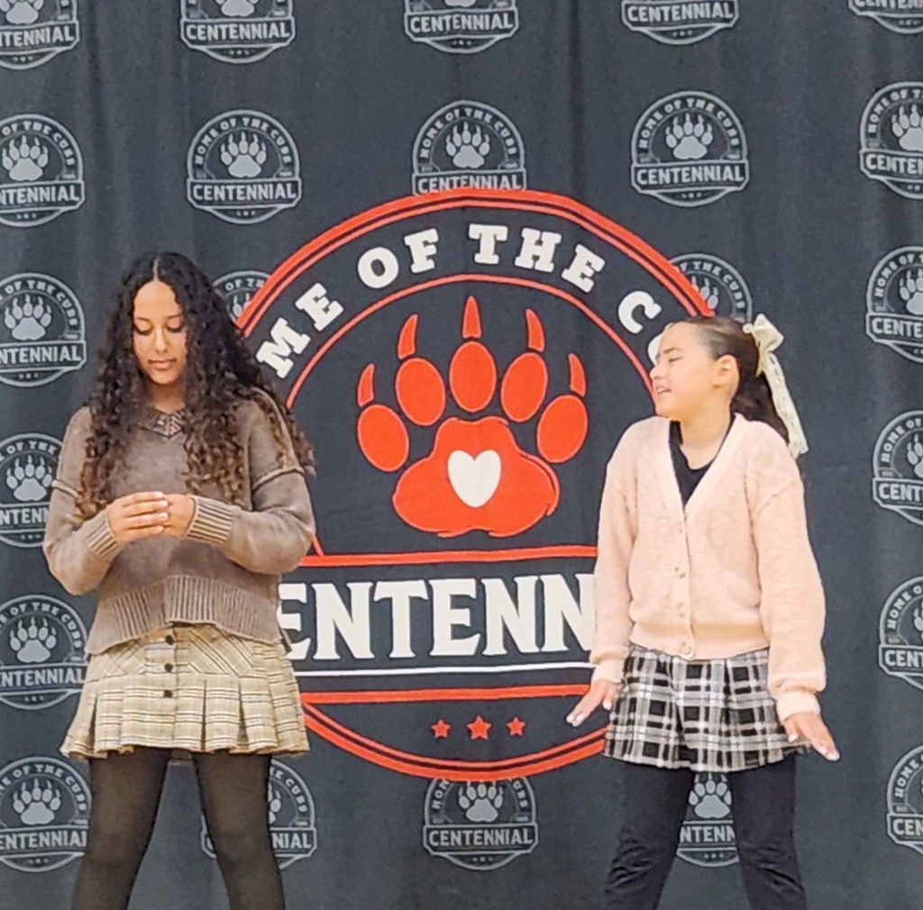 students performing on stage