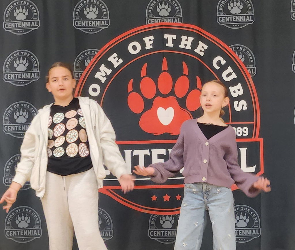 students performing on stage