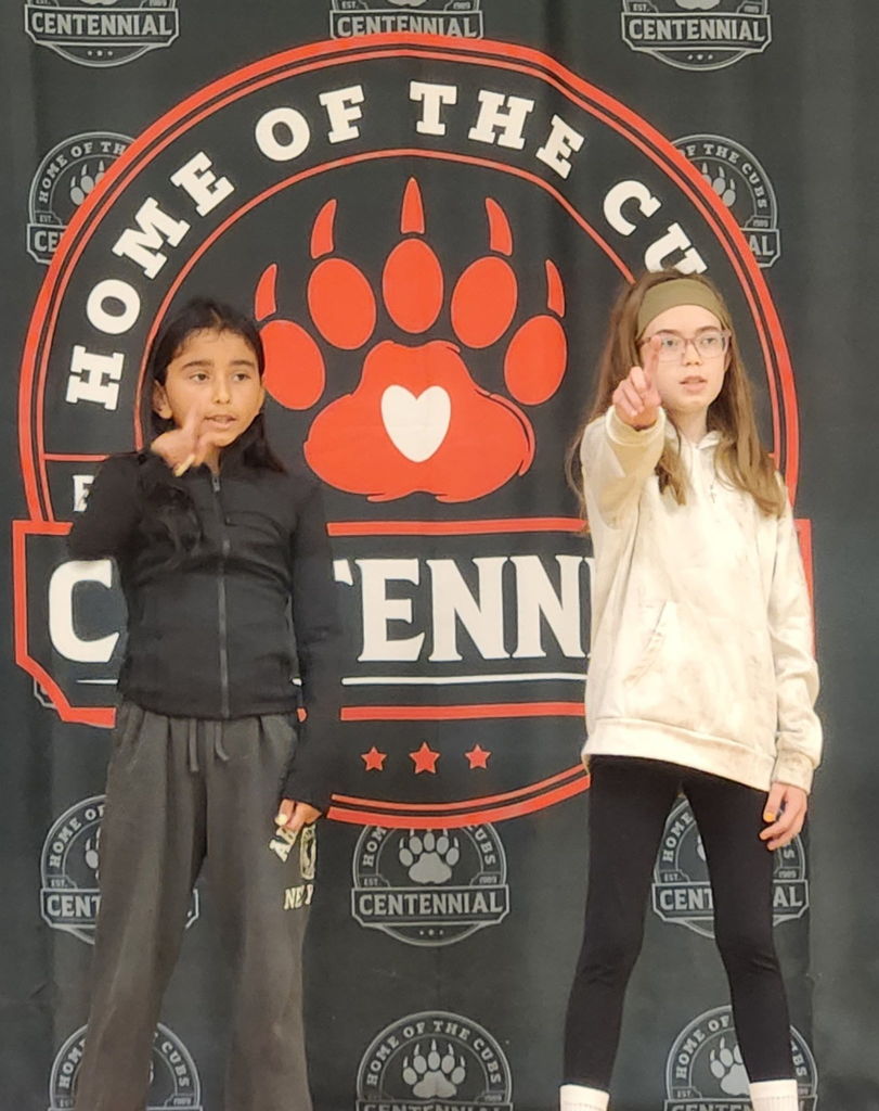 students performing on stage