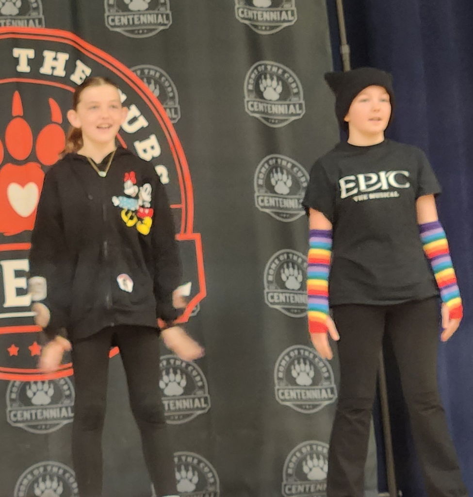 students performing on stage