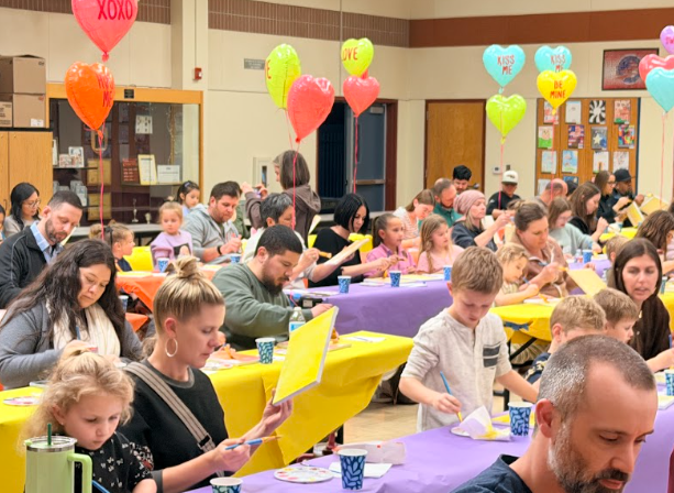 families painting at tables