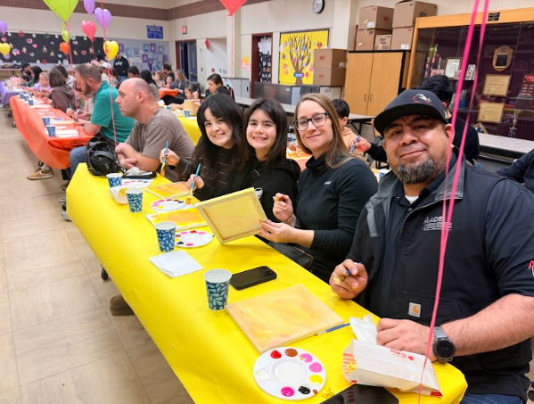 families painting at tables