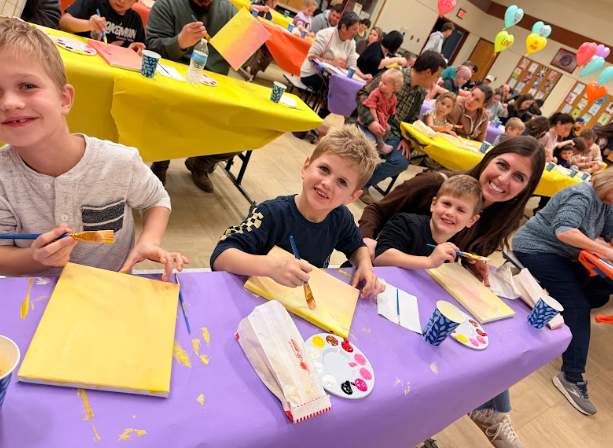 families painting at tables