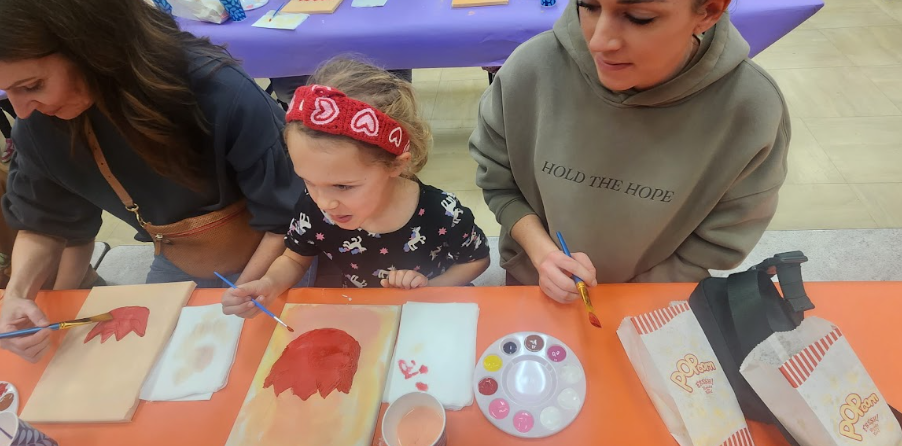 families painting at tables