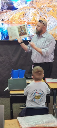 Celebrity reader reading to studentsCelebrity reader reading to students