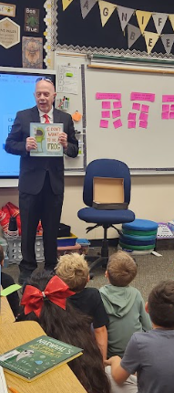 Celebrity reader reading to students