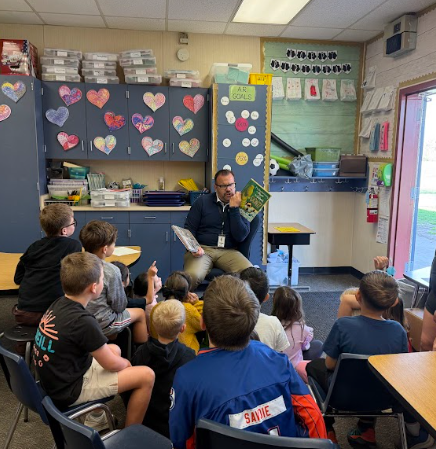 Celebrity reader reading to students