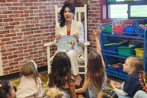 Celebrity reader reading to students