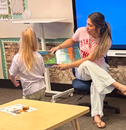 Celebrity reader reading to students