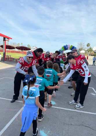 students getting high fives