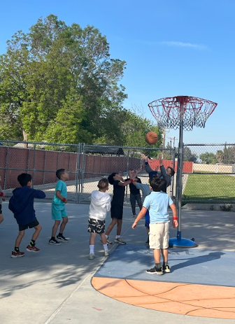 students playing basketball