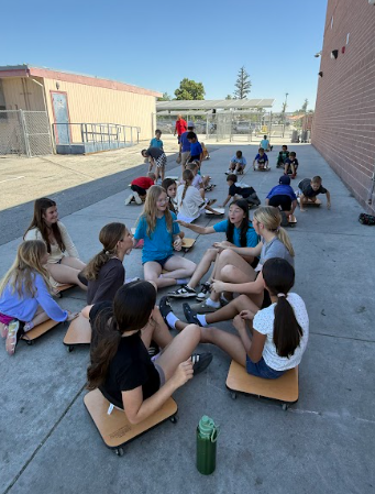 students on scooters