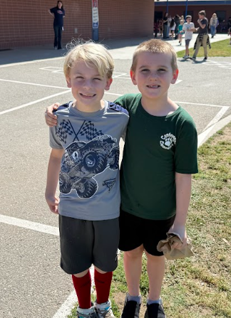 two students standing next to each other