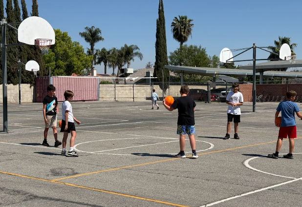 students playing basketball