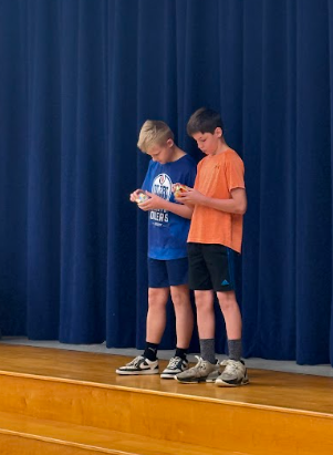 students solving rubix cubes