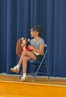 student with puppet