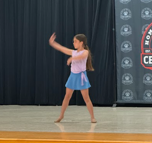 student dancing on stage