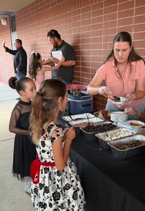 girls in line to get dessert