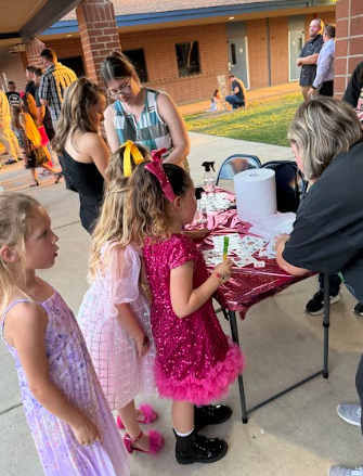 girls waiting to get fake tatoos