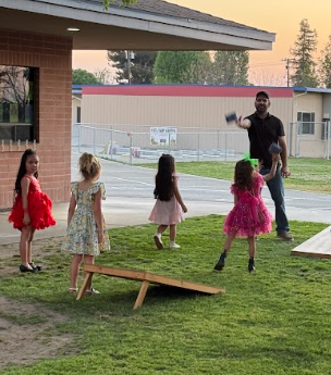 girls playing corn hole