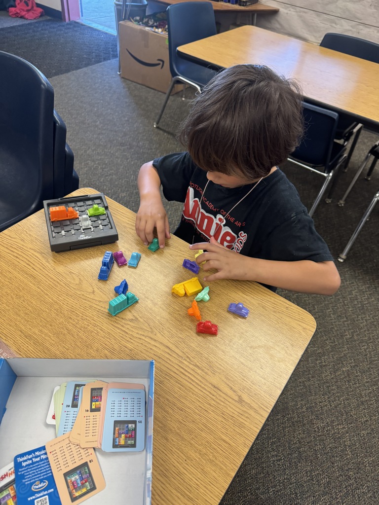 student playing with a puzzle