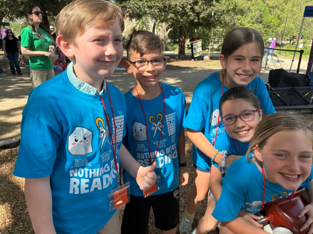 students in a group wearing the same shirt