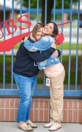 two ladies hugging