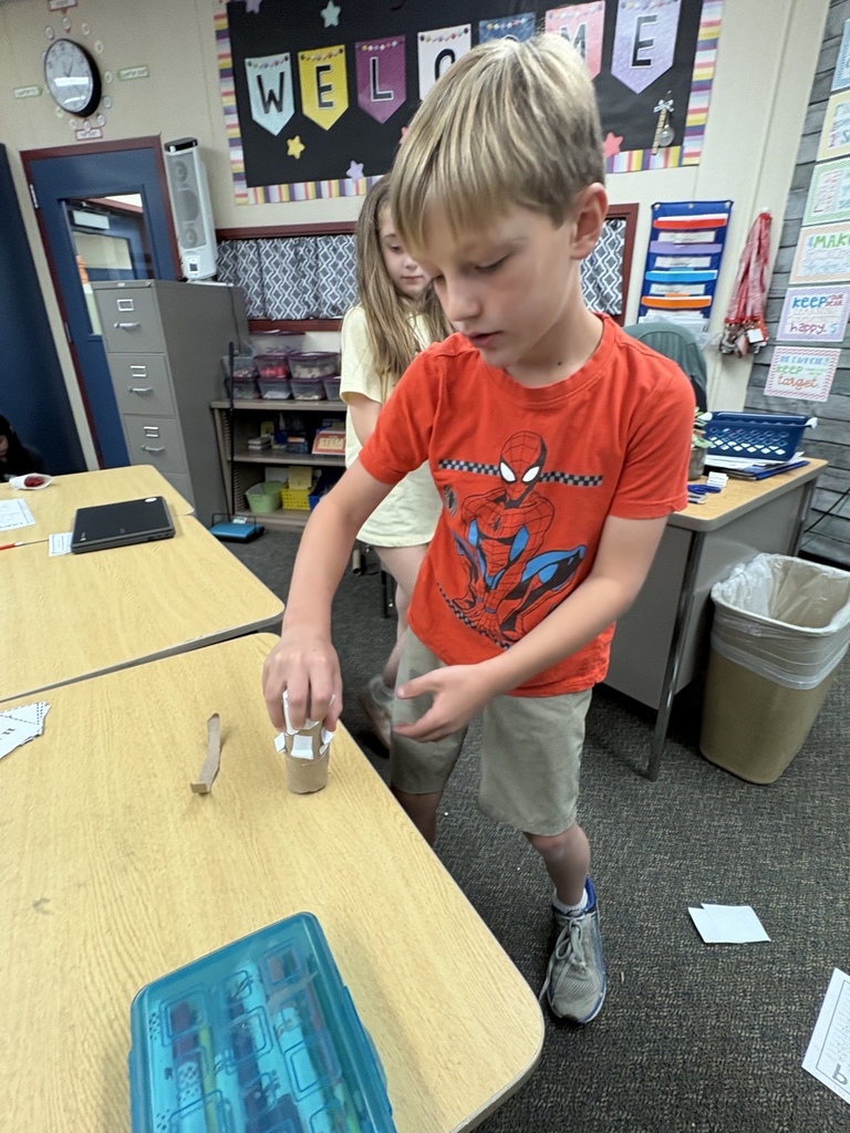 student with building materials 